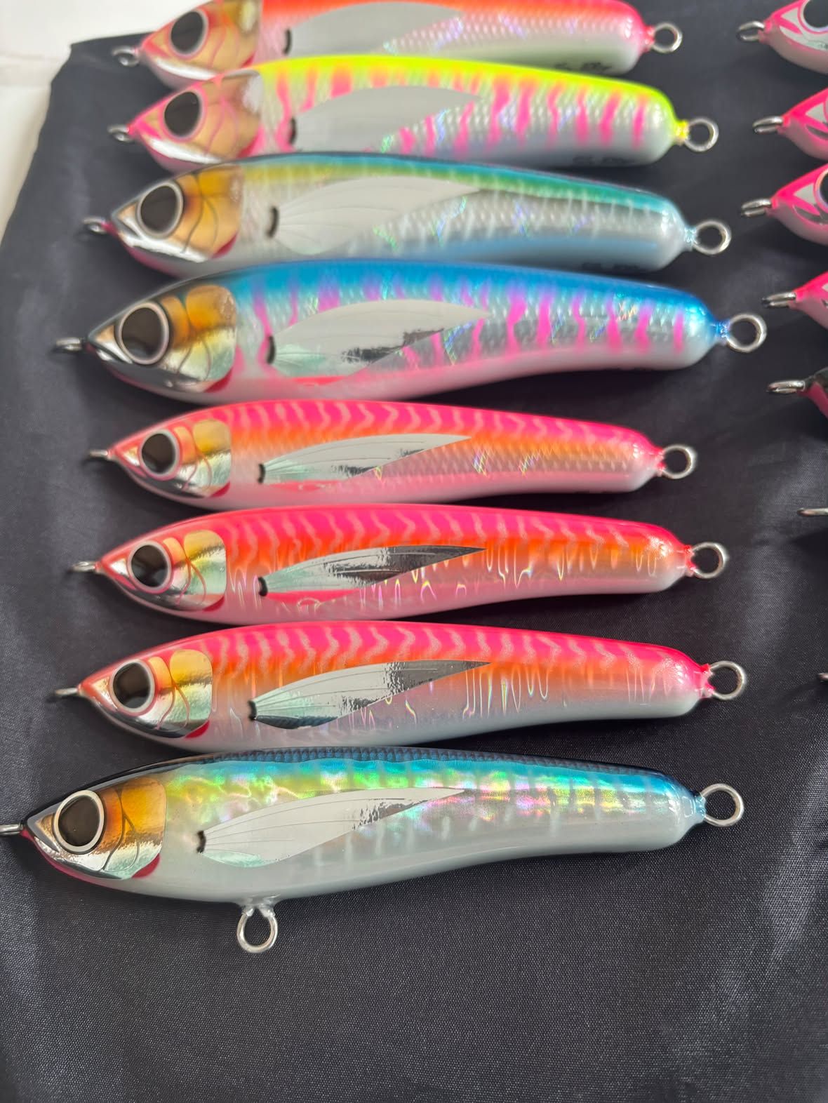 A lineup of hand-carved Kiba lures, each individually painted